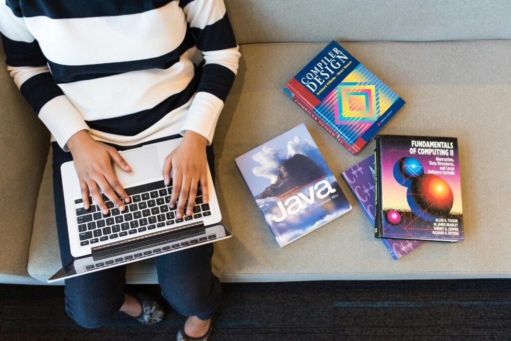 Person Using Macbook Pro On Person's Lap